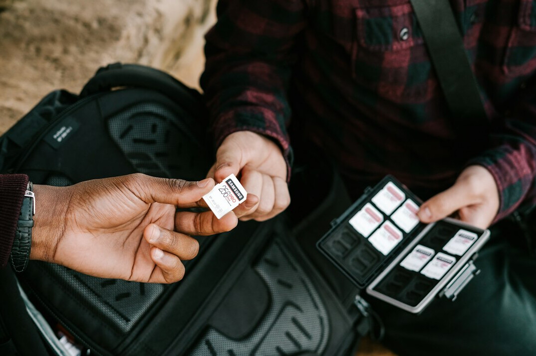 Marketing team reviewing a media kit presentation on a tablet