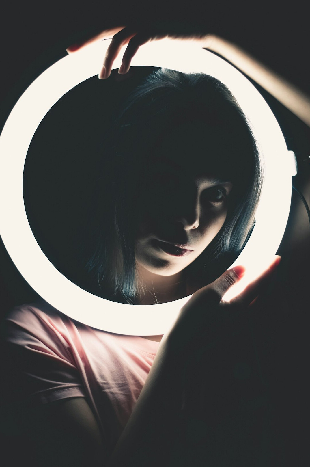 Content creator filming a social media video with ring light
